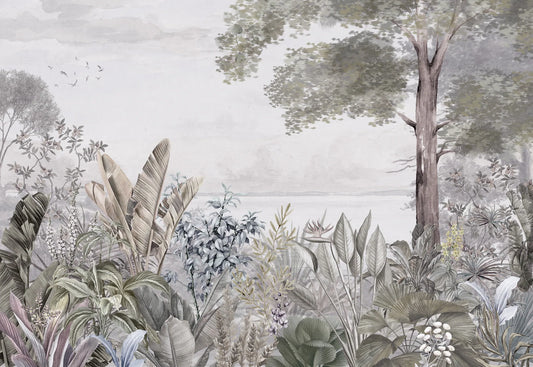 Papel tapiz mural con paisaje botánico en tonos grises, verde salvia y vegetación tropical frente al horizonte.