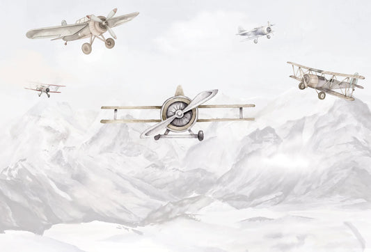Papel tapiz mural infantil con avionetas clásicas en acuarela volando sobre montañas en tonos grises y beige.
