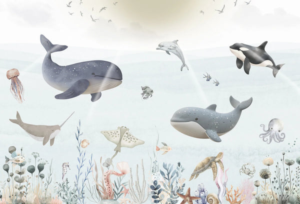 Papel tapiz mural infantil con ballenas, delfines y fauna marina en acuarela azul y gris