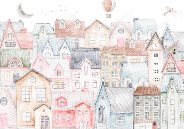 Papel tapiz infantil con diseño en acuarela de una ciudad con casitas pastel, globo aerostático, avión y luna.