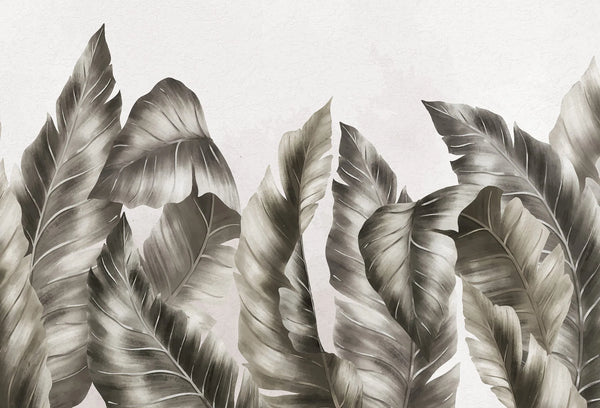 Papel tapiz mural con hojas tropicales grandes en tonos gris carbón y fondo beige texturado