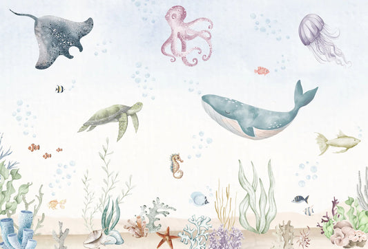 Papel tapiz mural infantil con diseño submarino de ballena, tortuga y corales en acuarela pastel.