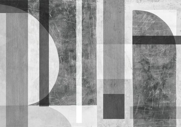 Papel tapiz mural abstracto con formas geométricas, arcos, líneas y textura de concreto en escala de grises.