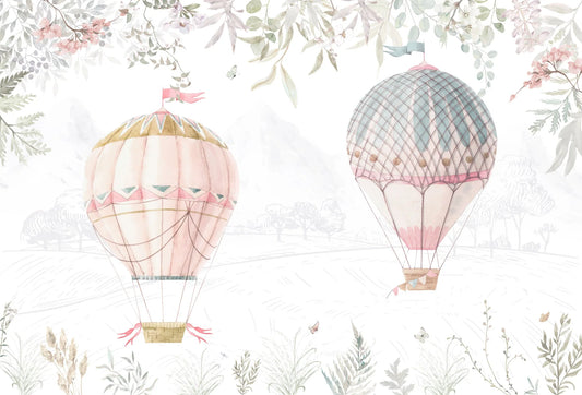 Papel tapiz mural infantil con globos aerostáticos vintage y follaje en tonos rosa pastel y verde salvia.